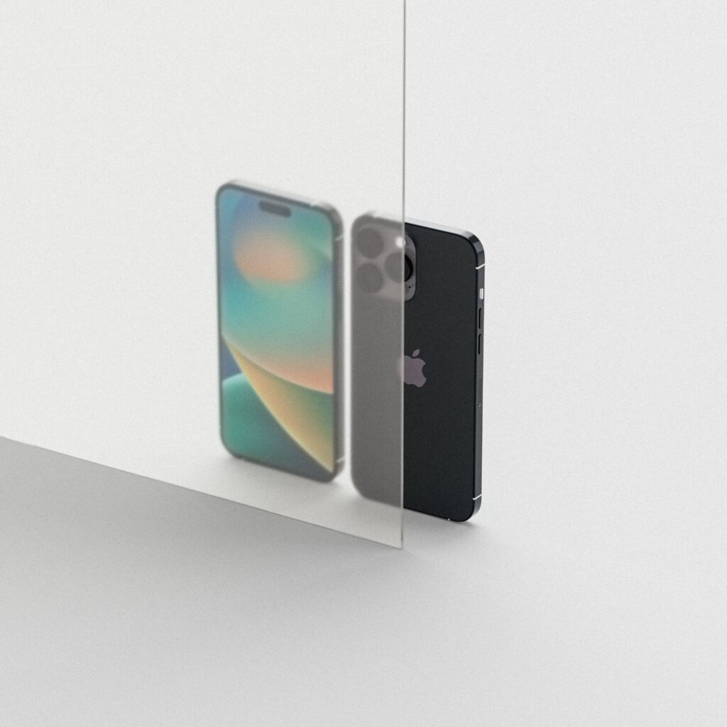 A sleek smartphone reflecting on a glass surface showcasing modern design.